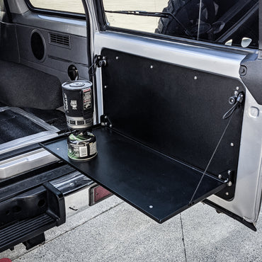 Landcruiser 76 rear barn door table doing its thing at sundown